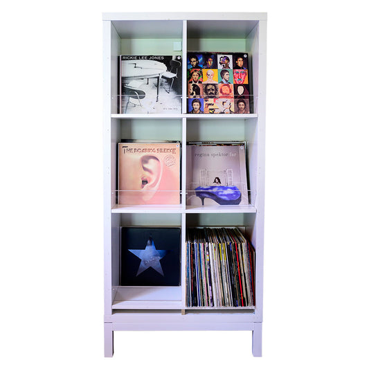 Vinyl record collection on shelves — CGT valuation and insurance documentation with VRT